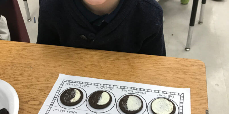 1st Grader with oreo moon phase calendar