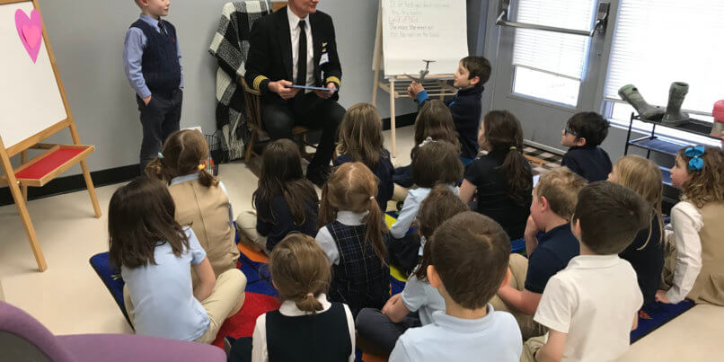 Delta Airlines pilot reading for 1st grade class