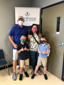 Family wearing masks ready for the first day of school!