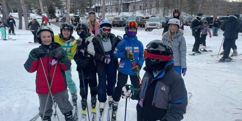 The Ivywood Ski Club pose for a picture on the hillside