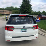 Car with "We love Ivywood" written on back window